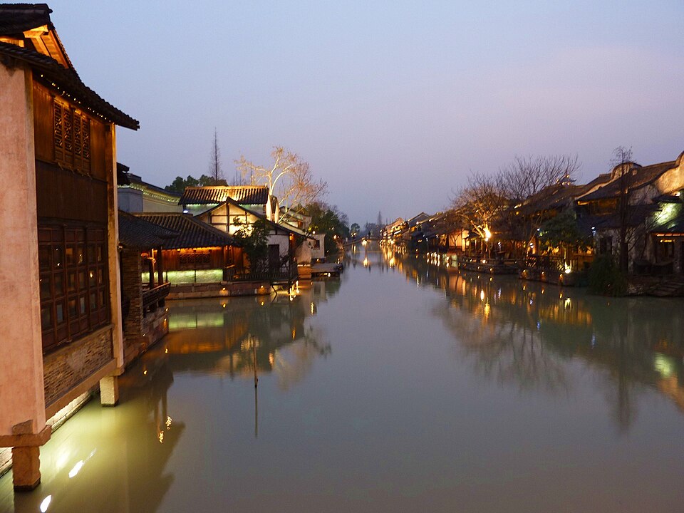 Wuzhen water town canal at night with lantern reflections