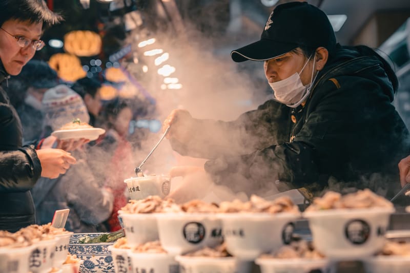 Muslim Quarter night market — sizzling skewers, steam rising, crowds